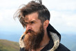 © be free - man hipster traveler with beard and moustache portrait on mountain