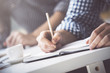 © peshkova - Businessman writing in notepad closeup