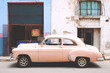 © Jessica Nash - Side view of pink vintage car parked on street