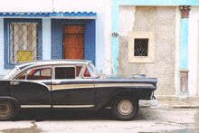 Side View Of Black Vintage Car Parked On Road