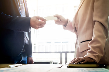 Closeup portrait of two successful business executive exchanging