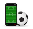 © siiixth - smartphone with a football field and soccer football