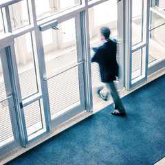 man walking out of a business office