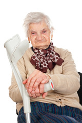 Wall Mural - Elderly woman holding her crutch