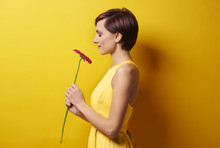 Young Woman Against Yellow Wall