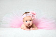 Cute Little Baby Girl In A Nice Pink Flared Dress