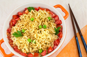 Wall Mural - noodles with tomato and peas in a bowl