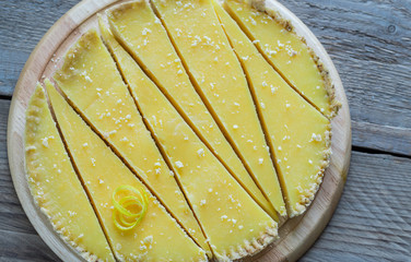 Wall Mural - Lemon tart on the wooden background