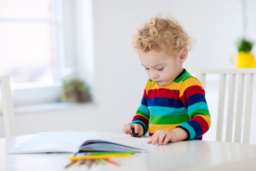 Wall Mural - Kids read, write and paint. Child doing homework.