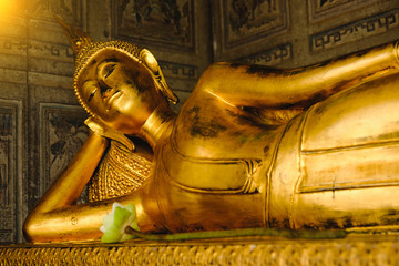 Public place Reclining Buddha gold statue in church Wat Suthattepwararam temple Bangkok, thailand.