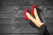 © kieferpix - Closeup of woman's sexy legs in red high heels.