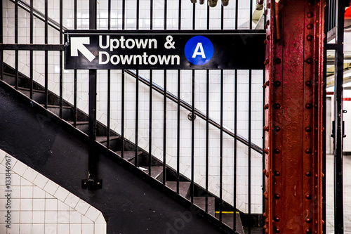 Fotografía New York City Subway inside and underground with steps and directional sign for Uptown Downtown A train