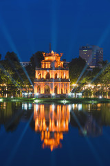 Wall Mural - Turtle Tower, the symbol of Vietnam, at twilight period at Hoan Kiem lake (Ho Guom or Sword lake)