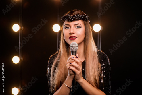 Young Smiley Beautiful Long Hair Girl In Black Dress With