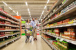 © Syda Productions - family with food in shopping cart at grocery store