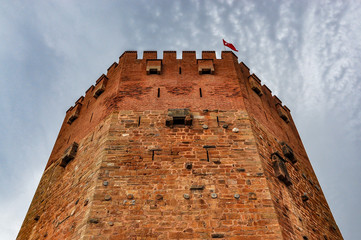Canvas Print - Red tower (Kizil Kule) in Alanya on a cloudy day, Turkey