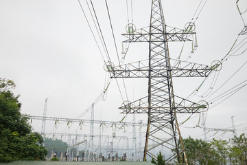 High voltage power lines in Hoa Binh province, Vietnam, Asia, on misty day