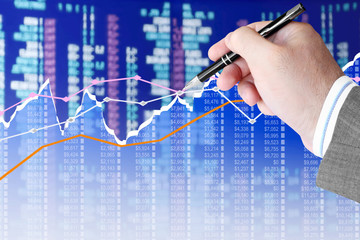 Fototapete - Businessman analyzing financial chart