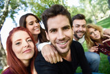 Fototapeta  - Group of friends taking selfie in urban background