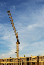 Crane At Construction Site Against Sky