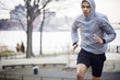 © Cavan Images - Young male athlete running outdoors