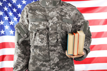 Poster - Soldier holding books. Military education concept