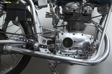 Close-up Of Motorcycle Engine Against White Wall