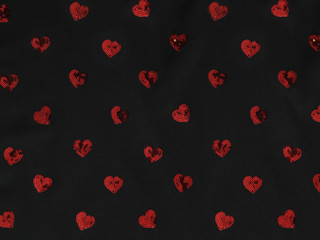 Wall Mural - Red sequins heart and black textile background