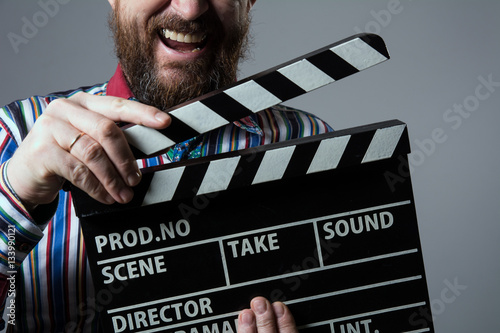 Fotografie, Tablou Close-up of a man smiling clapperboard cinema