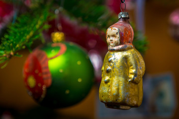 Closeup of old Christmas tree decoration on bright background