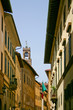 Charming street with visible above the tower of Arnolfo in Florence, Italy.