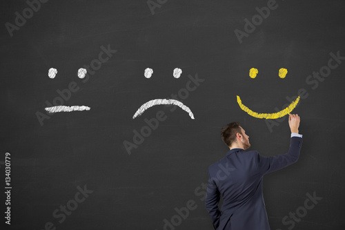 Fotografía Unhappy and happy on chalkboard background