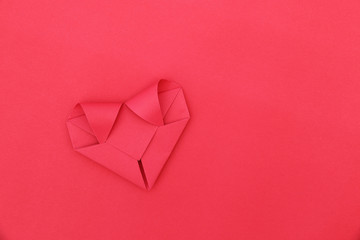 Poster - one folding red paper heart on red for pattern and background