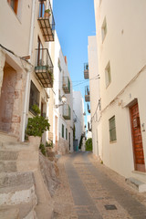 Canvas Print - Street in old town of Peniscola, Costa del Azahar, province of Castellon, Valencian Community. Peniscola is a popular tourist destination in Spain