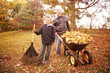 © soupstock - Father and son raking leaves