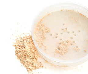 Close-up of cosmetic loose powder in jar