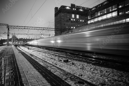 Black and white photo the train at night on long exposure railway station Poster