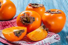 Persimmons On Table