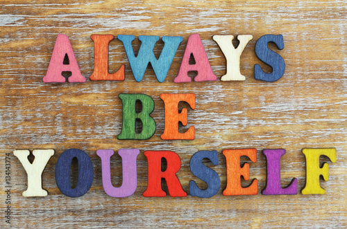 Always be yourself written with colorful wooden letters on rustic surface Poster