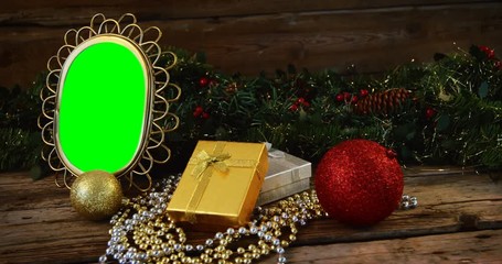 Poster - Christmas decoration and ornaments on wooden plank