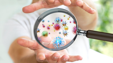 Poster - Close up on a sick man hand through magnifying glass transmittin