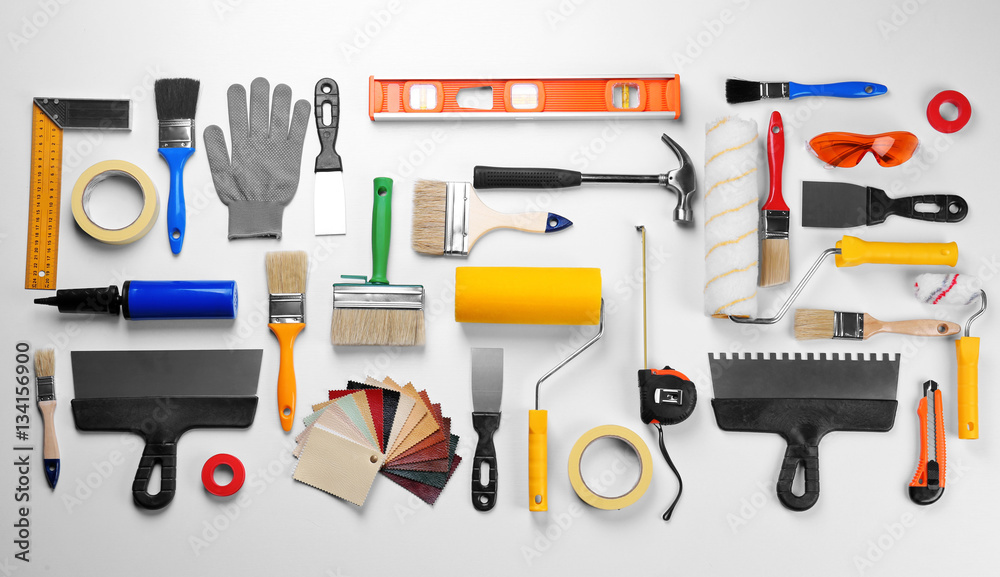 Set of professional decorator equipment on white background