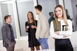 © Addoro - Face of beautiful woman in front of business people.