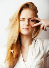 Wall Mural - young blond woman on white backgroung gesture thumbs up, isolate