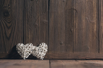 Wicker hearts on wood