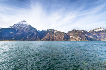 Canvas Print - Alps Canton of Uri. Switzerland. Mountain landscape. Windy day on the lake. Dynamic clouds in the sky.