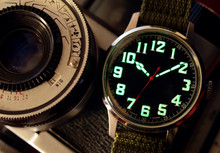 Vintage Black  Watch Close Up Over Vintage Camera
