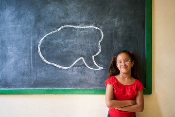 Wall Mural - Happy Student Looking at Camera With Cloud On Blackboard