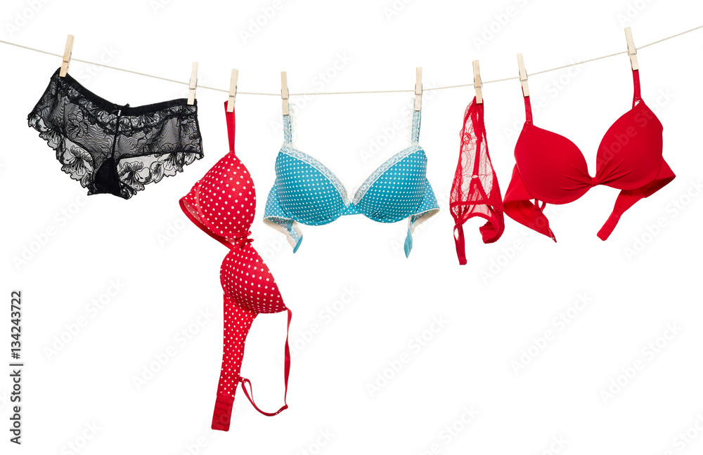 Female panties and bra hanging on rope - obrazy, fototapety, plakaty 