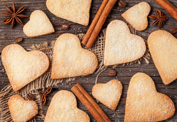 Wall Mural - Delicious cookie on the valentine's day. Lovely heart shaped a shortcake dough for valentines. Homemade baking. Flat lay. Top view.